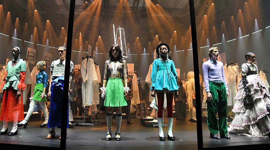 models standing on stage wearing clothes from yeucci season 1