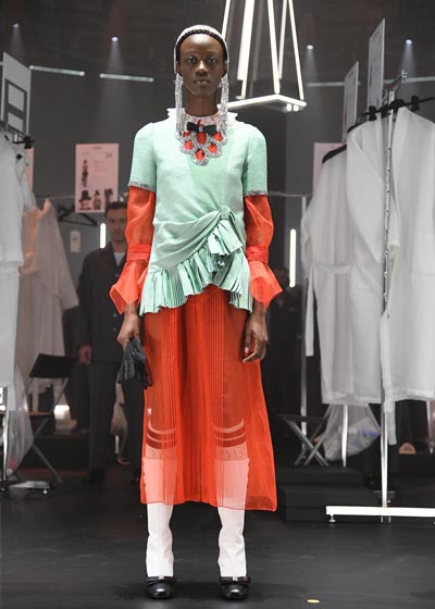model wearing orange dress