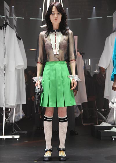model wearing green skirt